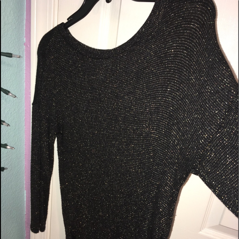 Black and glittery long sleeved shirt